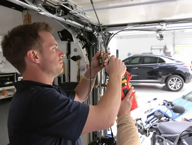 Richmond Heights Garage Door Repair safety certified technician performing cable replacement in Richmond Heights