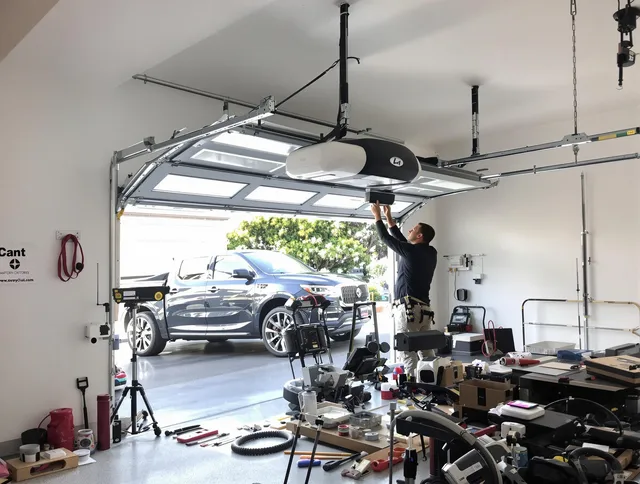 Richmond Heights Garage Door Repair specialist installing smart garage door opener system in Richmond Heights home