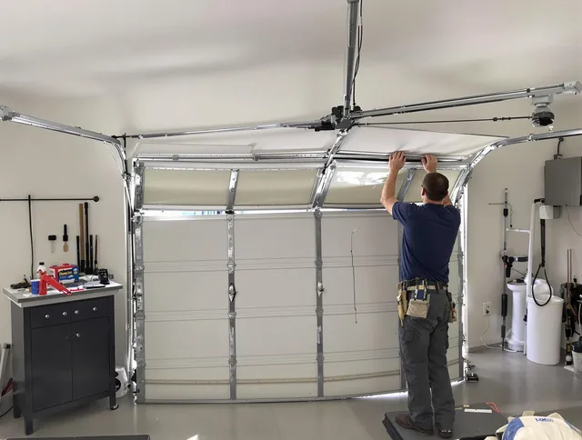 Richmond Heights Garage Door Repair specialist performing precise section replacement on Richmond Heights garage door