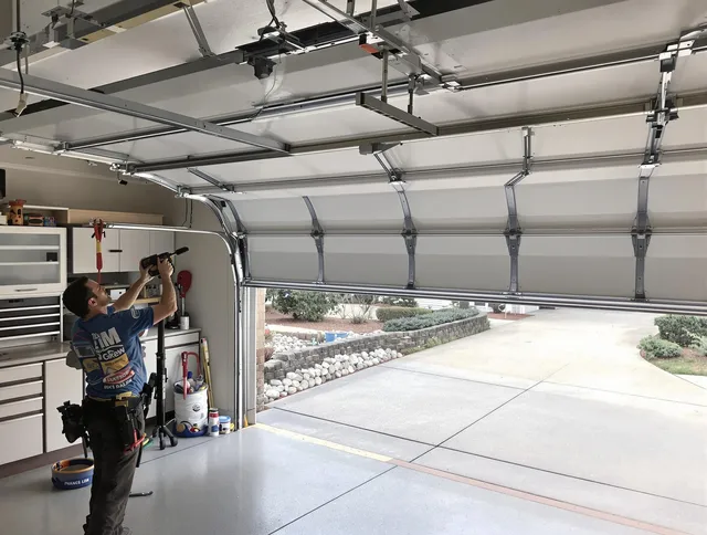 Garage door track repair service by Richmond Heights Garage Door Repair in Richmond Heights
